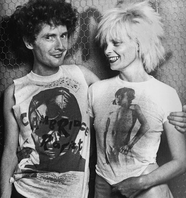Malcolm McLauren & Vivienne Westwood 1976 wearing some X-rated explicit shirt of their creation.  PunkMetalRap.com